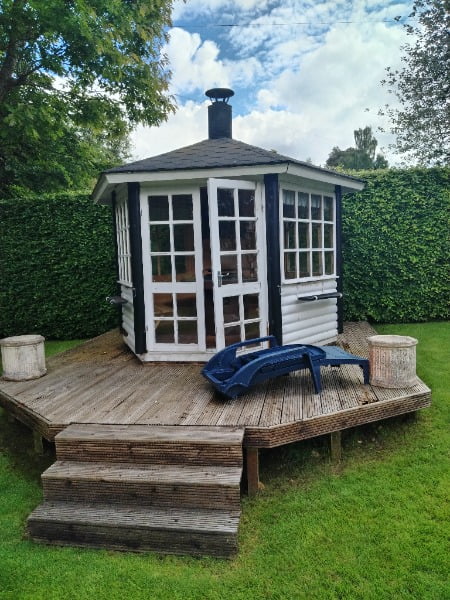 An old summer house with decking before demo and removal by Junk-it crew